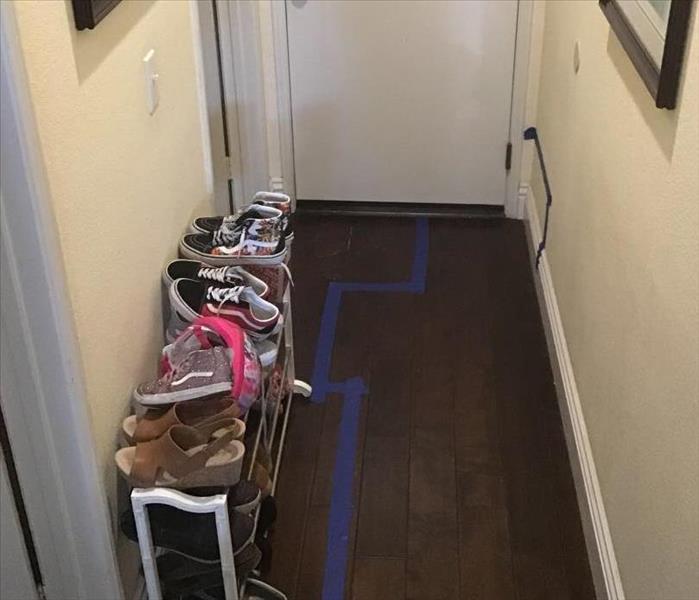 Wood floor with blue tape